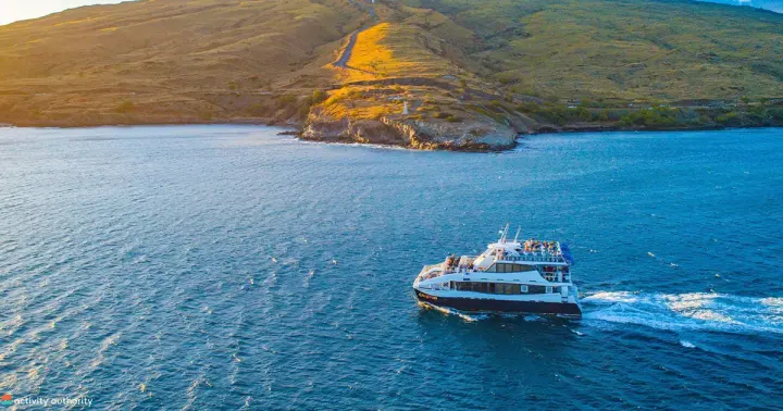 Calypso catamaran cruising along the Maui coastline