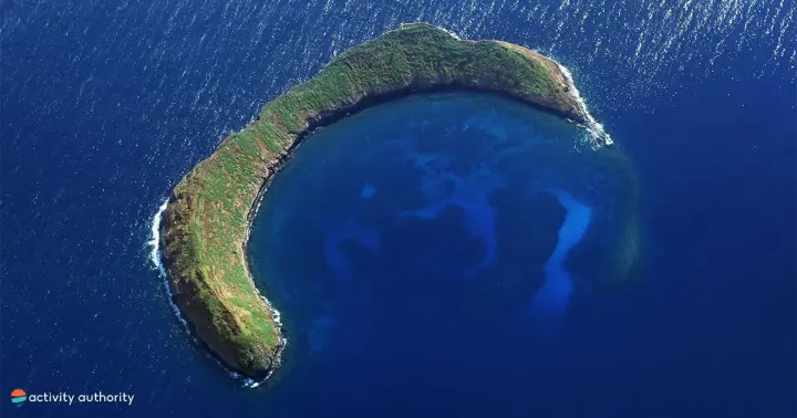 Aerial view of the Molokini Crater crescent surrounded by deep blue water